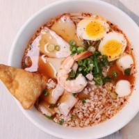 House Tom Yum · Spicy. Spicy tom yum flavored rice noodle soup with lime, ground peanuts, ground pork, slice...