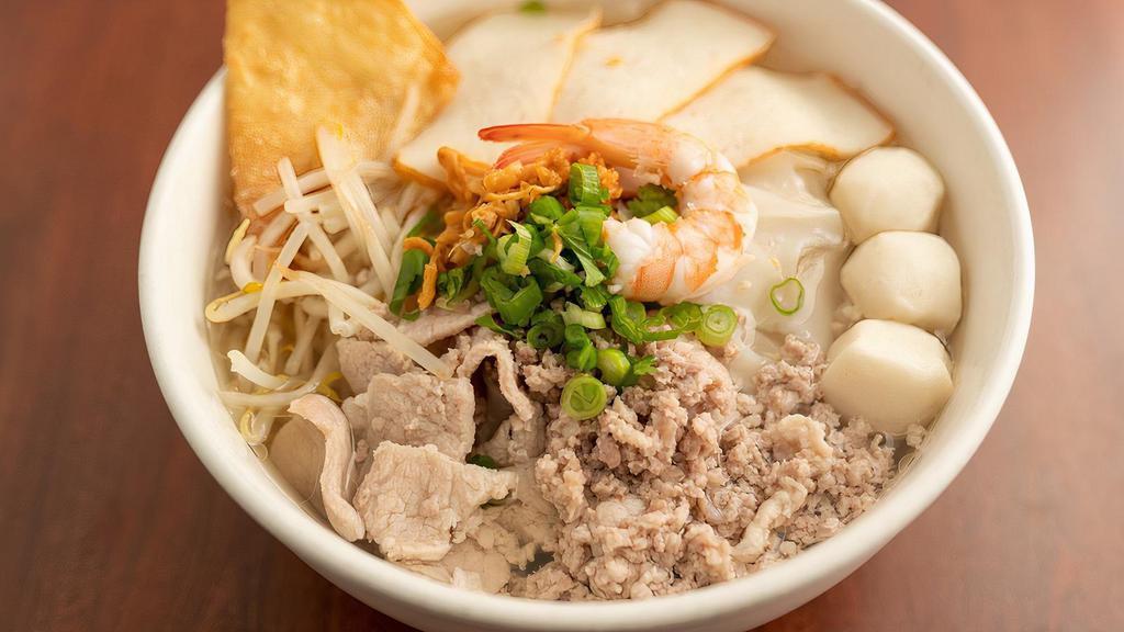 House Noodle · Clear broth noodle soup with rice noodles, ground pork, sliced pork, fish balls, fish cake, shrimp, bean sprouts, minced green onion, and fried wonton.