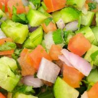 Shirazi Salad · Diced tomatoes, cucumbers and onion with lemon juice