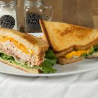 Albacore Tuna Melt · Our house recipe albacore tuna salad, melted cheddar cheese, lettuce, tomato, red onion, may...