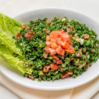 Tabbouleh · Vegetarian. Chopped parsley, cracked wheat, tomatoes, onion, lemon juice, and olive oil.