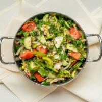 Armenian Salad · Sliced cucumbers, tomatoes, onions, and lettuce with oregano-citrus vinaigrette.