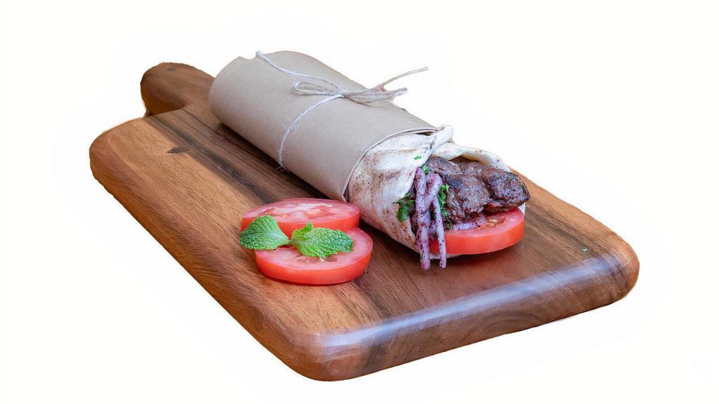 Lula Kebab · Minced beef or chicken, onion, parsley, tomatoes, and pickled turnips.
