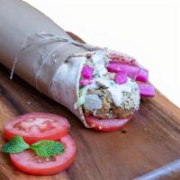 Falafel Sandwich · Spheres of crushed chic peas and spices, lettuce, tomatoes, parsley, pickled turnips, and ta...