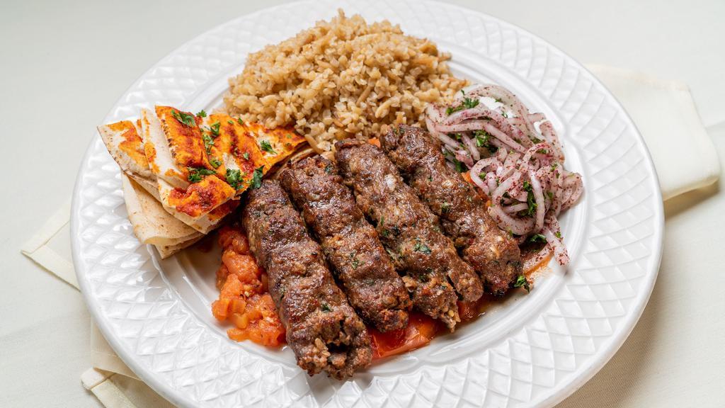 Khash-Khash Kebab · Beef lula, garlic, and lightly spiced broiled tomatoes.