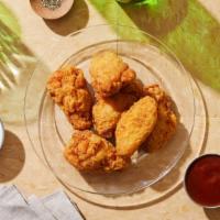 Chicken Wings · Six crispy chicken wings in buffalo sauce.