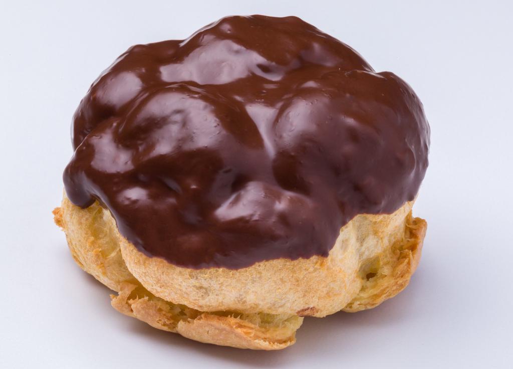 Chocolate Eclair · Our éclair shells are comprised of the original choux pastry topped with rich chocolate, which creates a delightful taste when paired with our cream fillings.