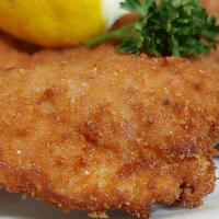 Giant Schnitzel · W/ roasted potatoes and a special cucumber salad