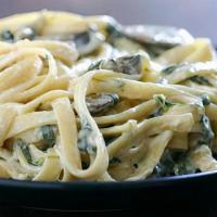 Fettuccine Alfredo · spinach, mushrooms, creamy garlic sauce, Parmesan
