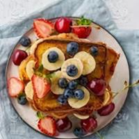 Captain America · French toast, strawberries, grilled bananas, blueberries, powdered sugar