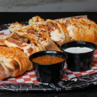 The Meatyzone Calzone · DoughBoys Red Sauce, Fresh Grated Mozzarella & Cheddar Cheese Blend, Pepperoni, Italian Saus...