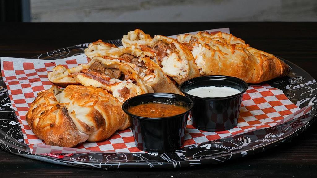 The Meatyzone Calzone · DoughBoys Red Sauce, Fresh Grated Mozzarella & Cheddar Cheese Blend, Pepperoni, Italian Sausage, Linguiça, Sliced Salami, and Hickory Smoked Bacon