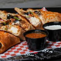 The Veggiezone Calzone · DoughBoys Red Sauce, Fresh Grated Mozzarella & Cheddar Cheese Blend, Red Onions, Diced Tomat...