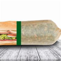 The Mood Enhancer Grilled Italian Sub · Premium Genoa salami, capacolla, prosciuttini, onions, and provolone cheese, topped with let...