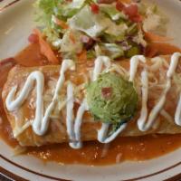 Laura'S Burrito · Meat, rice, and beans inside sauce, melted cheese with our favorite spanola sauce, sour crea...