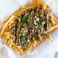 Philly Fries · Gyro Meat, Onion, Bell Peppers, Mushrooms, and sauce over a bed of fries