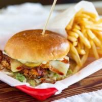 Spicy Chicken Sandwich · Chicken breast with Sweet Baby Ray's Nashville hot sauce, swiss cheese, lettuce, and pickles...
