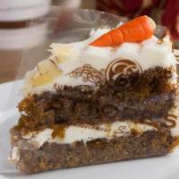 Slice Of Carrot Cake · Two layers of carrot cake made with pineapple and specialty spices, filled and finished with...