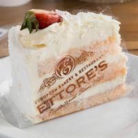 Slice Of Strawberry White Chocolate Mousse · Three layers of strawberry sponge cake, filled with creamy white chocolate mousse and a laye...
