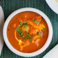 Boneless Butter Chicken · Boneless chicken roasted in a clay oven then finished with a buttery and smoked tomato curry...