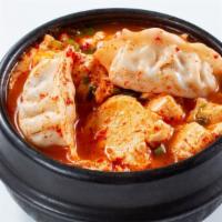 Dumpling Tofu Soup · Vegetable or beef dumpling. Topped with green onions. Vegetarian friendly (vegetable dumplin...