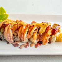 Tiger Roll · Shrimp tempura with avocado (in), tiger shrimp, spicy sauce, eel sauce, sriracha and garlic ...