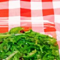 Seaweed Salad (90 Gm) · Seaweed salad with vinegar, soy sauce, sesame oil and garlic. Topped with sesame seeds.