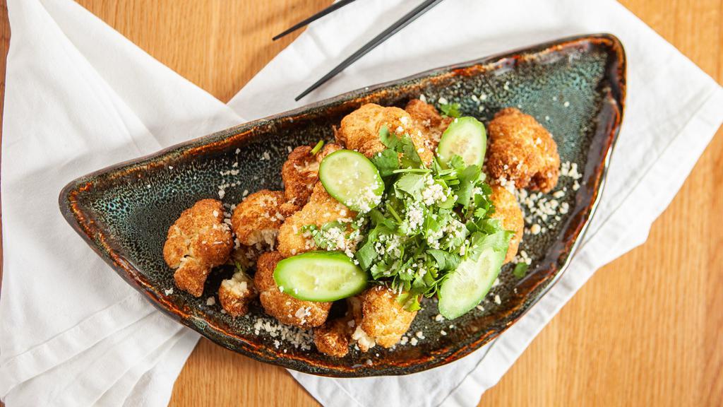 Crusted Parmesan Cauliflower · Tossed in sweet & tangy dressing, pickle cucumbers, crispy fried shallots, cilantro  and parmesan cheese.