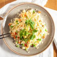House Fried Rice · Fried rice mixed with egg, onions, carrots & peas and topped with cilantro.