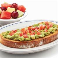 Classic Avocado Toast · Sourdough toast topped with freshly smashed avocado, diced tomatoes, a squeeze of lemon juic...