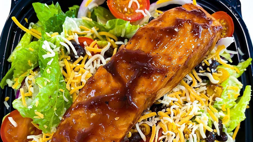 Bbq Salad · grilled 8 oz salmon, romaine, tomato, corn, red onion, black beans, four cheese blend, BBQ sauce, cool ranch dressing