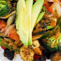Vegan Bowl · Vegan. Roasted cajun cauliflower, charred broccoli, mushroom, onion, avocado, chipotle sauce...