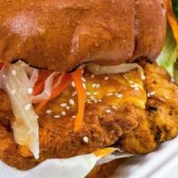 Chicken Sandwich · fried chicken, cheddar cheese, iceberg lettuce, pickled slaw mix, sesame seeds, spicy mayo, ...