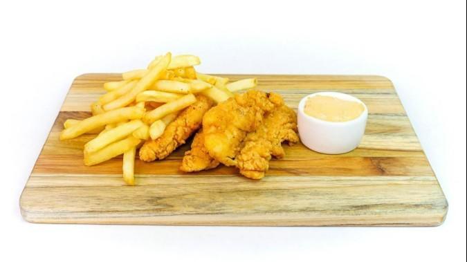 Chicken Tenders · Chicken tenders cooked golden-brown and crispy, served with a side of fries and your choice of dipping sauce.