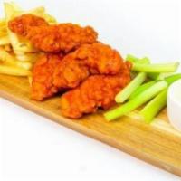 Buffalo Chicken Tenders · Chicken tenders cooked golden-brown and crispy, tossed in a buffalo sauce, and served with f...
