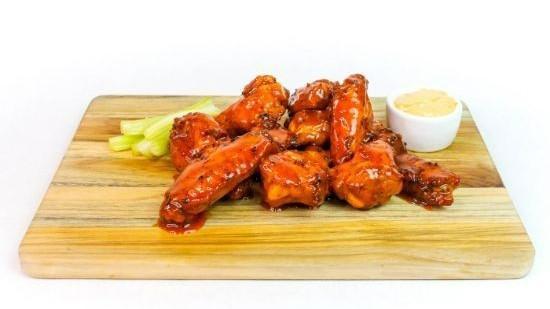 Buffalo Wings · Ten deep-fried crispy wings tossed in buffalo sauce. Served with celery sticks and your choice of dipping sauce.