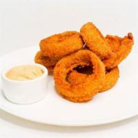 Onion Rings · Crisp, golden-brown beer battered onion rings served with your choice of dipping sauce.