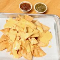 Queso Nachos · Warm tortilla chips, chipotle queso sauce.