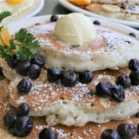 Blueberry Pancakes · 3 Fluffy Blueberry Pancakes dusted with powdered sugar. Served with butter and syrup