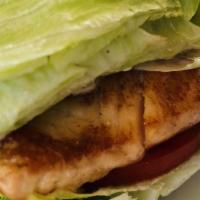 Salmon Sandwich · Lettuce, red onion, tomato, mayo served on a Brioche bun.