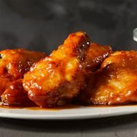 Medium Honey Garlic Wings · Wings tossed in a honey garlic sauce, with the perfect hint of spice. Served with a choice o...