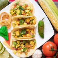 Vegan Zucchini Tacos (4) Con Arroz Y Frijoles · These versatile vegan tacos are packed with Mexican zucchini(calabacitas), tomato, red onion...