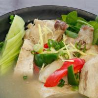 Tinolang Manok (Chicken In Ginger Soup) · Chicken soup with pepper leaves in broth flavored with ginger, onions and fish sauce.