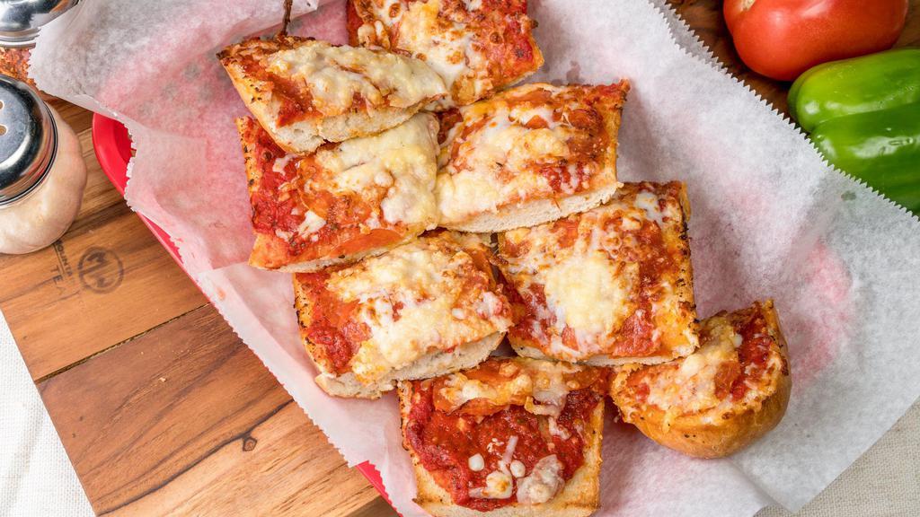 Pepperoni Pizza Bread · Sourdough bread brushed with olive oil, garlic and marinara sauce then topped with pepperoni, mozzarella and parmesan cheese, then toasted.
