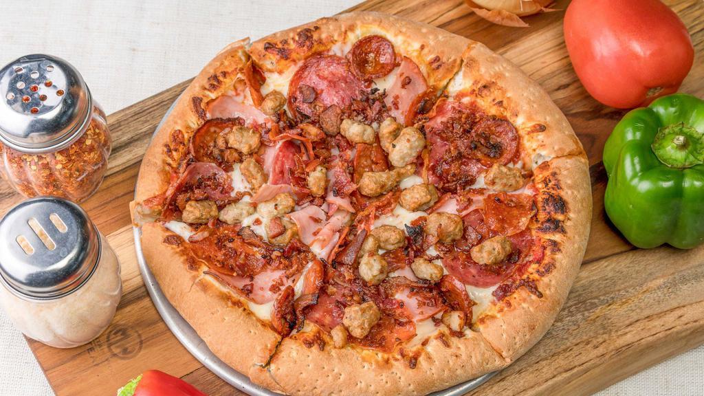 Carnivore · Cotto salami, pepperoni, Canadian bacon, linguica, Italian sausage, applewood smoked bacon and mozzarella cheese.