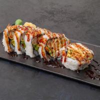 Shrimp Tempura Cut Roll · Fried shrimp tempura, cucumber, avocado, crab, eel sauce and sesame seed.