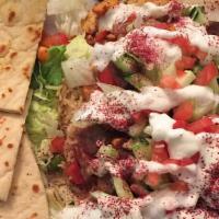 Combination Gyro Plate · Combination of beef and chicken served over rice and lettuce, tomatoes, cucumbers and tzatzi...