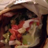 Lamb Gyro · Hot delicious pile of fresh off the spit gyro with lettuce, onions, tomatoes and tzatziki sa...