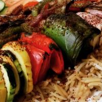 Veggie Kabob · Charbroiled tomato, zucchini, onions, red and green bell pepper.