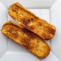 Garlic French Bread · An item not to be forgotten with any meal! French bread baked golden brown with our homemade...